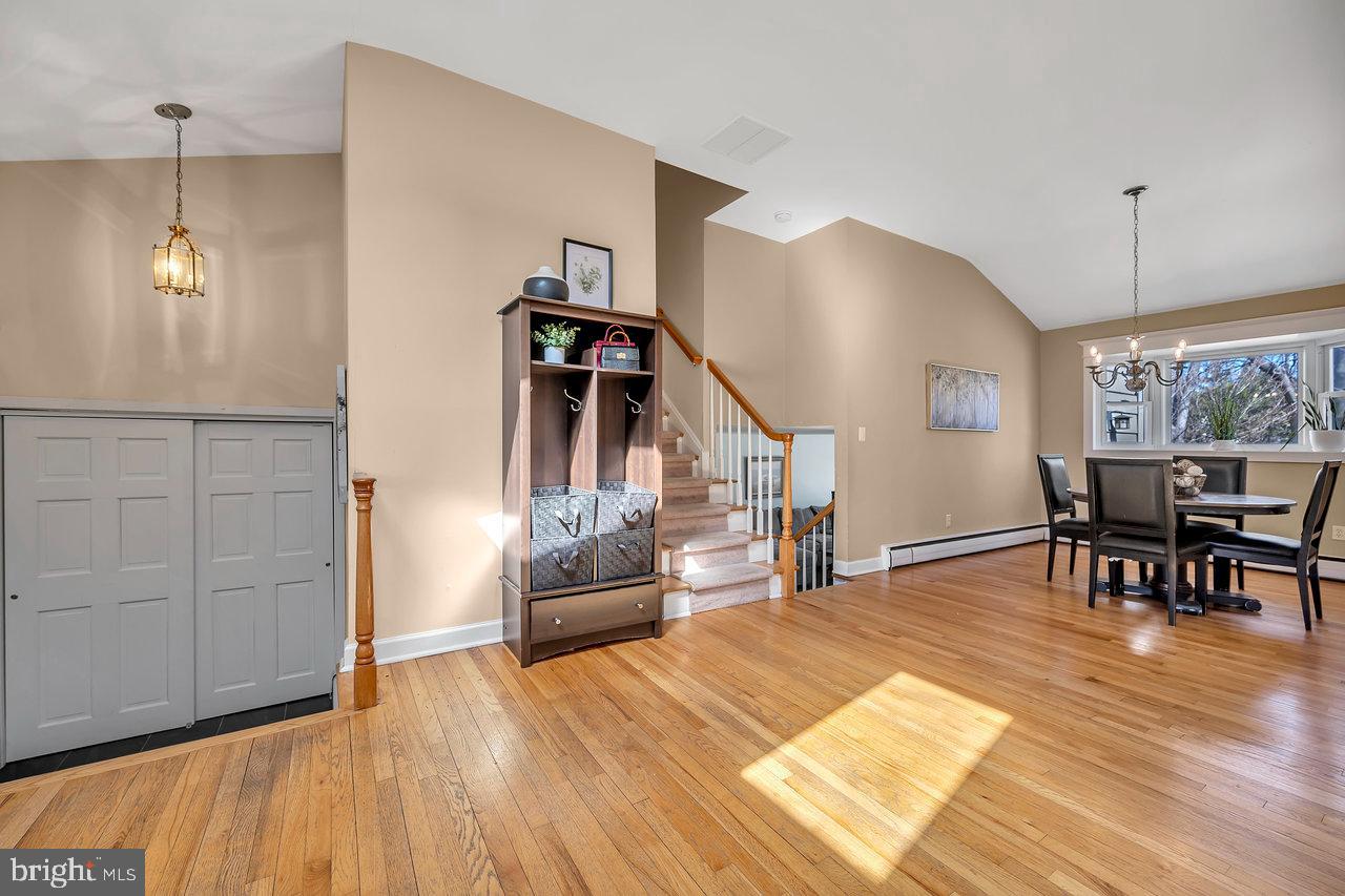 23 Griggs Road Cranbury, NJ 08512 - Photo 8 of 40 a living room with furniture and wooden floor