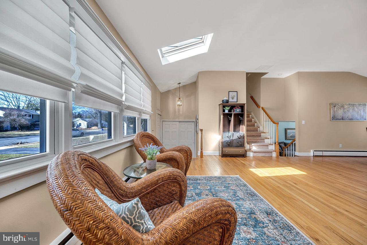 23 Griggs Road Cranbury, NJ 08512 - Photo 9 of 40 a living room with furniture and a table