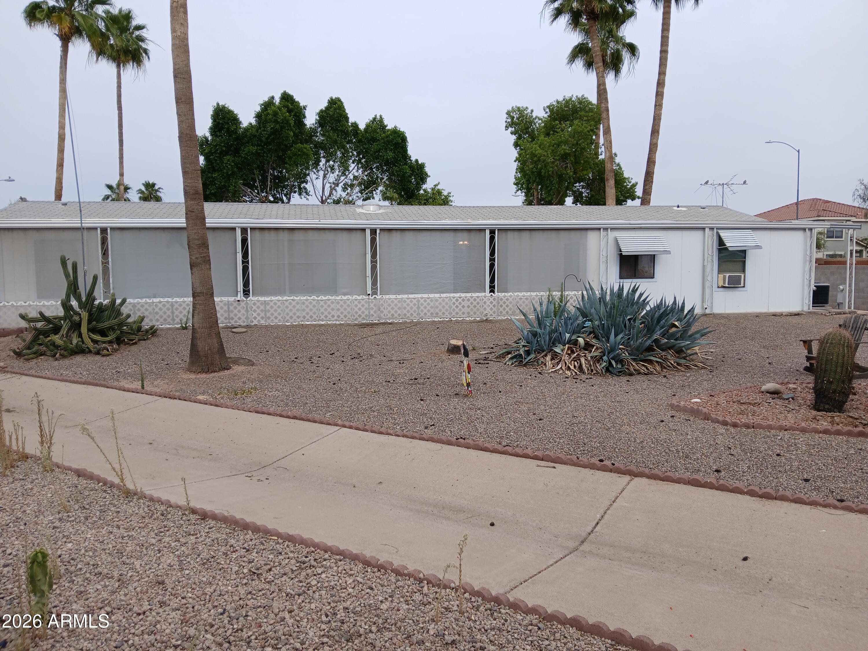 834 South Meridian Road, Unit 162 Apache Junction, AZ 85120 - Photo 20 of 32 a view of a terrace with a garden