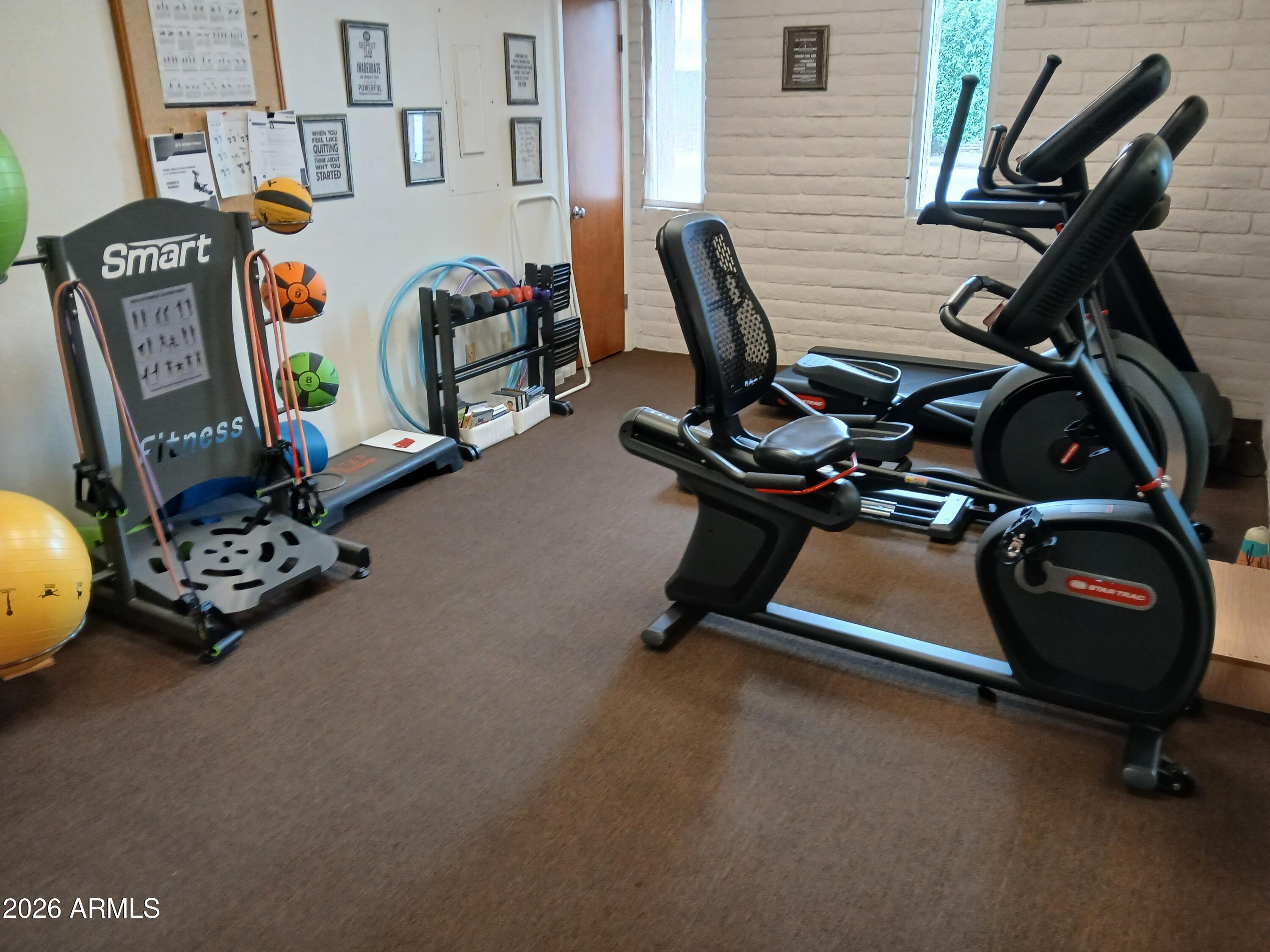 834 South Meridian Road, Unit 162 Apache Junction, AZ 85120 - Photo 25 of 32 a view of a room with gym equipment