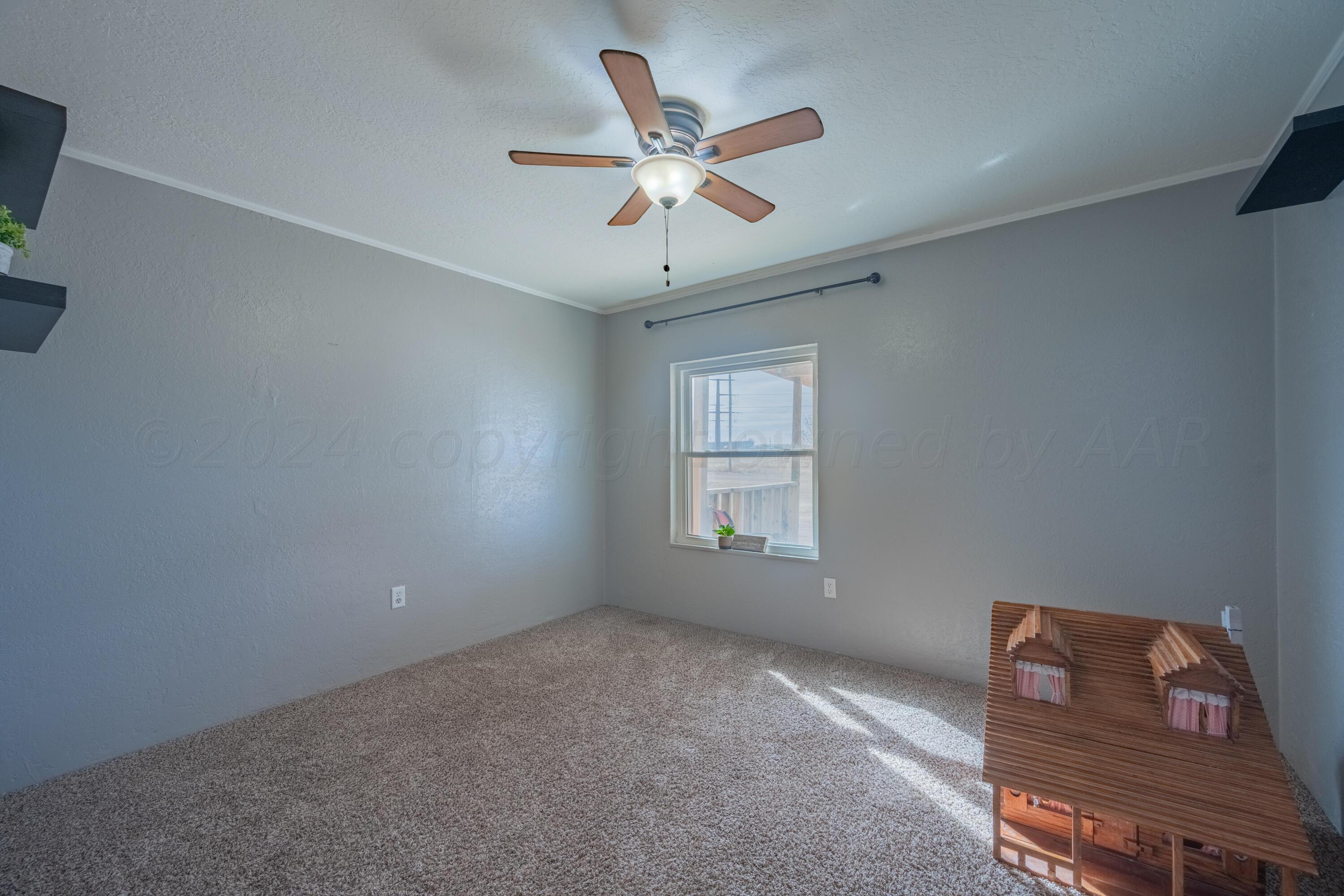 8701 Foxtail Street Amarillo, TX 79118 - Photo 25 of 33 a view of workspace with window ceiling fan