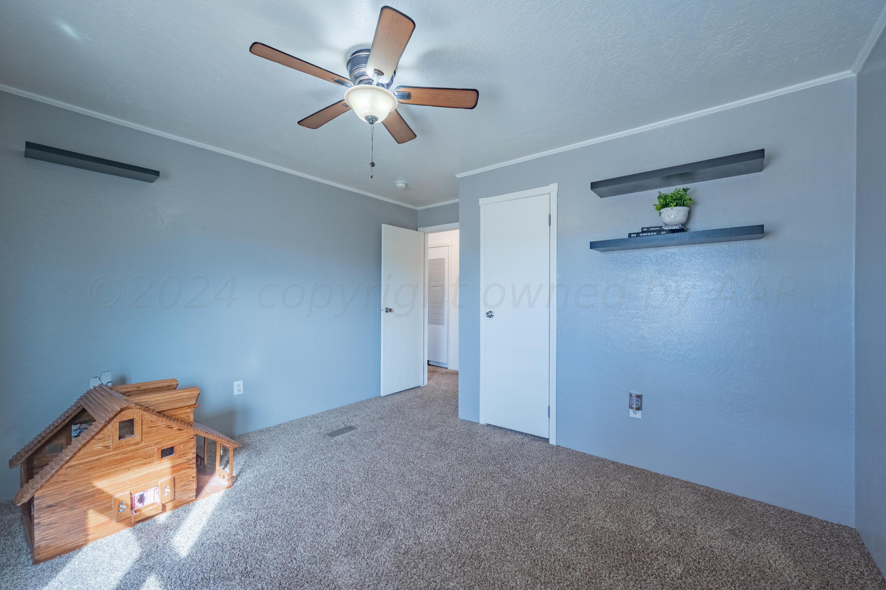 8701 Foxtail Street Amarillo, TX 79118 - Photo 26 of 33 wooden floor in an empty room