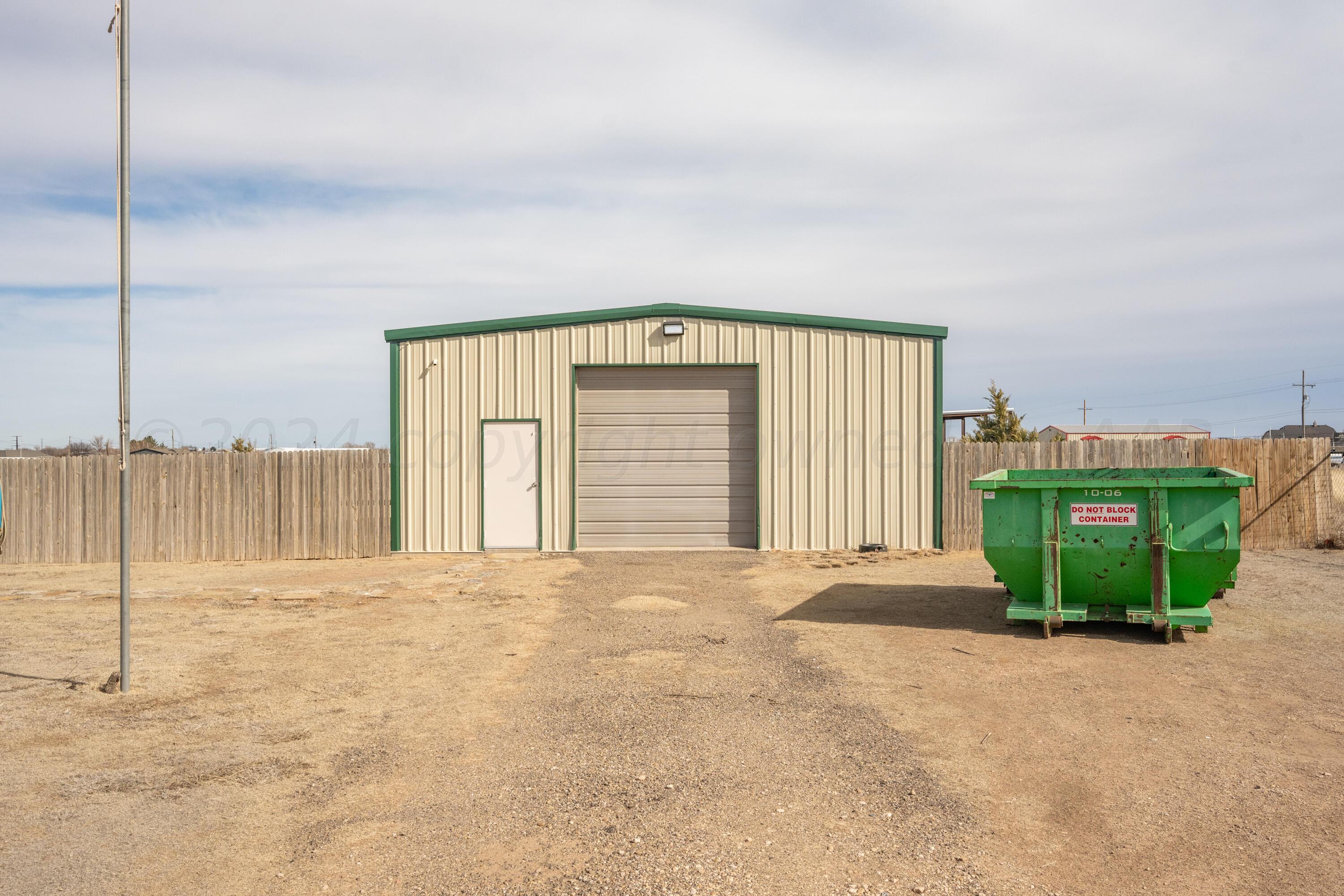 8701 Foxtail Street Amarillo, TX 79118 - Photo 3 of 33 a view of an empty room with a fireplace and a large window