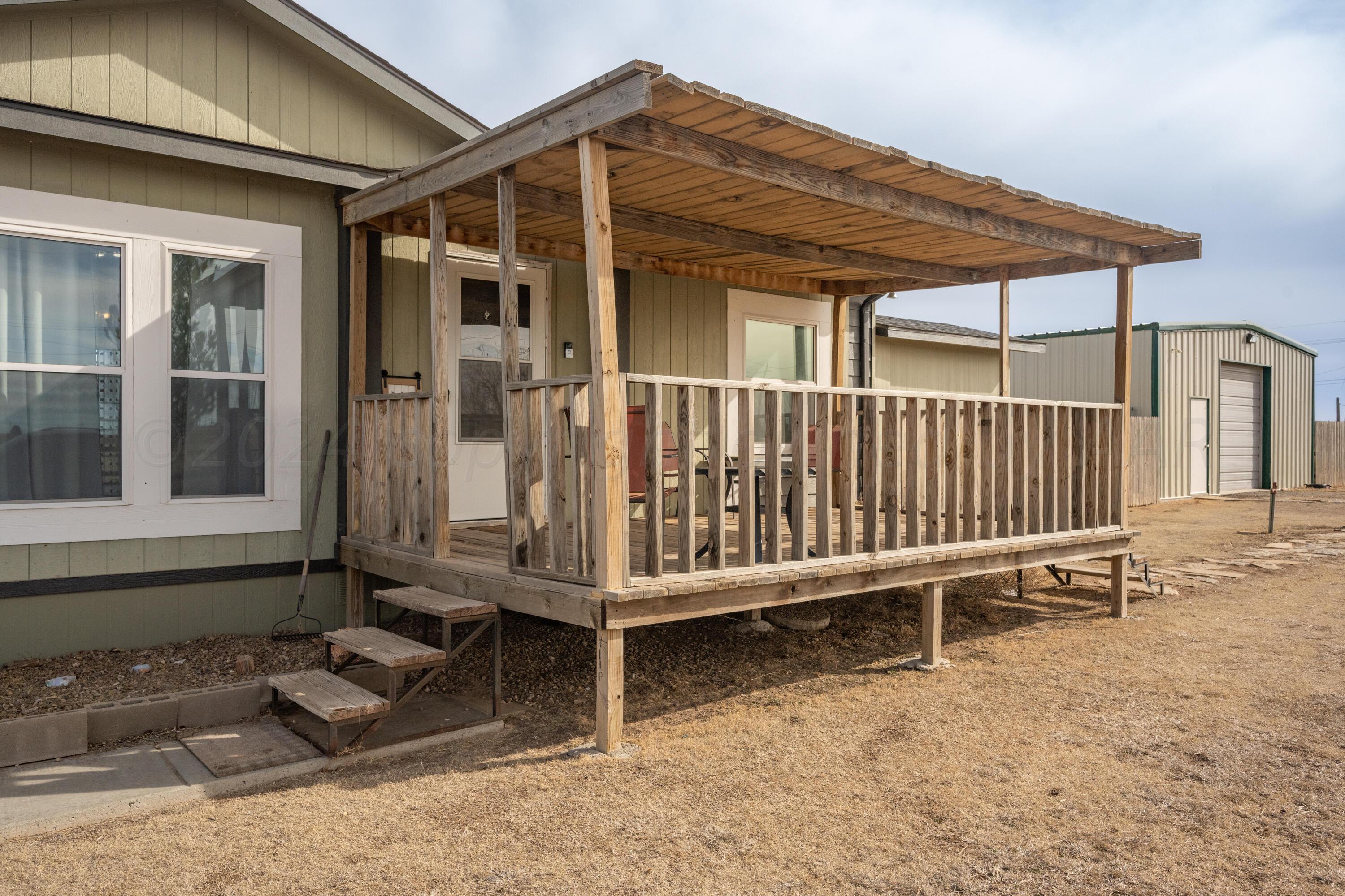 8701 Foxtail Street Amarillo, TX 79118 - Photo 5 of 33 a view of a house with wooden fence