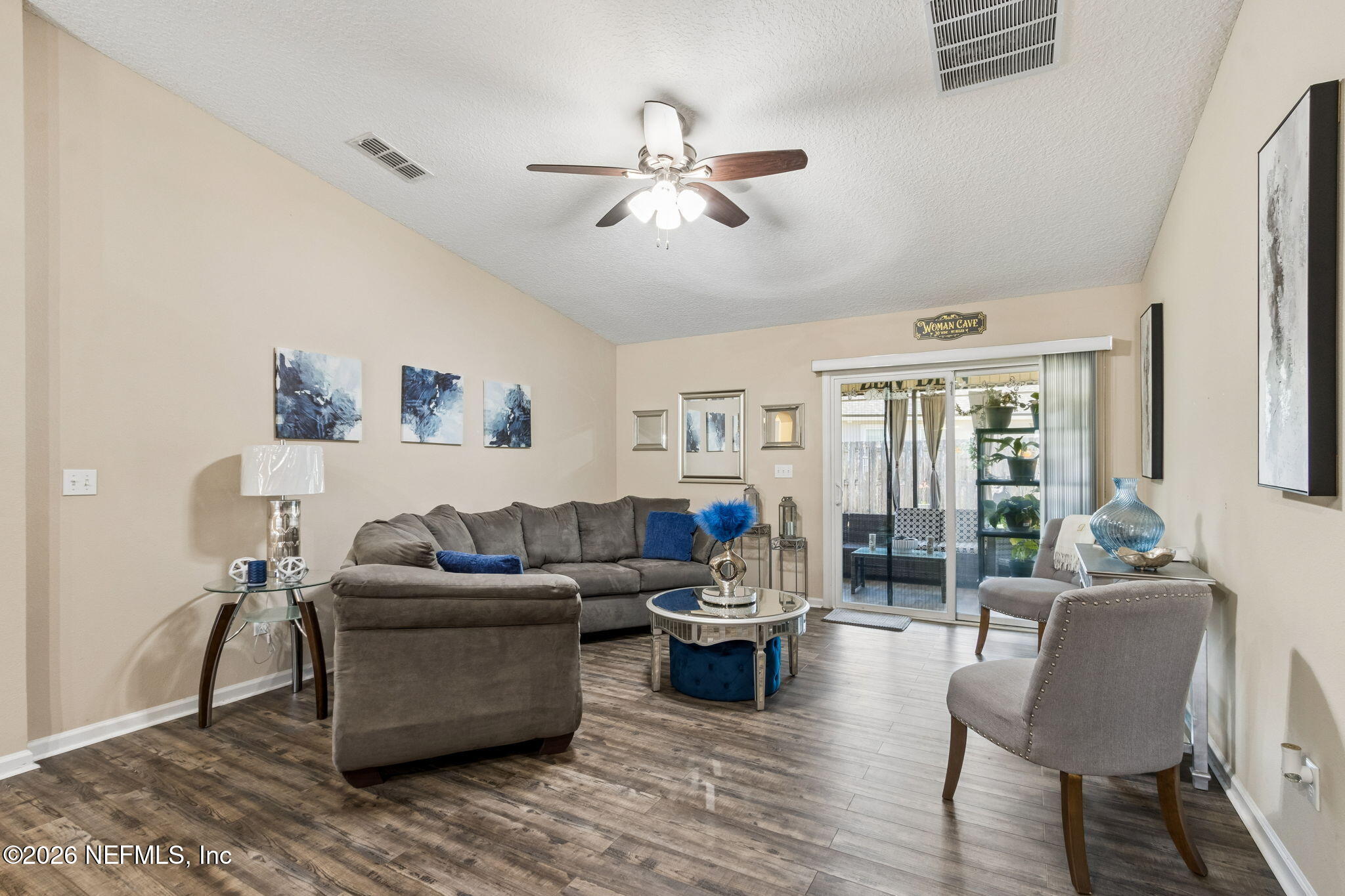 96034 Bass Lane Yulee, FL 32097 - Photo 13 of 50 a living room with furniture and a large window