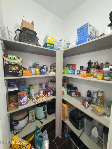 a kitchen with lots of clutter and cabinets