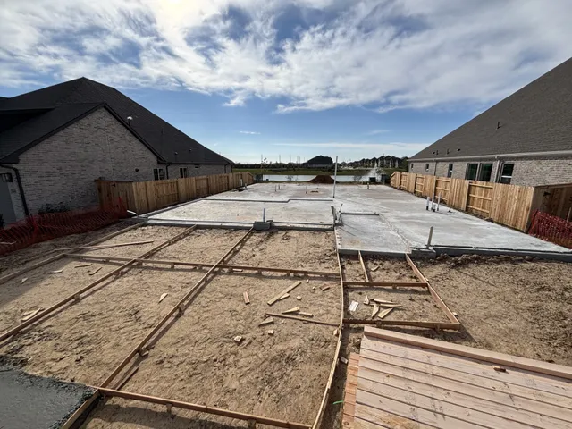 a view of a terrace with a wooden fence