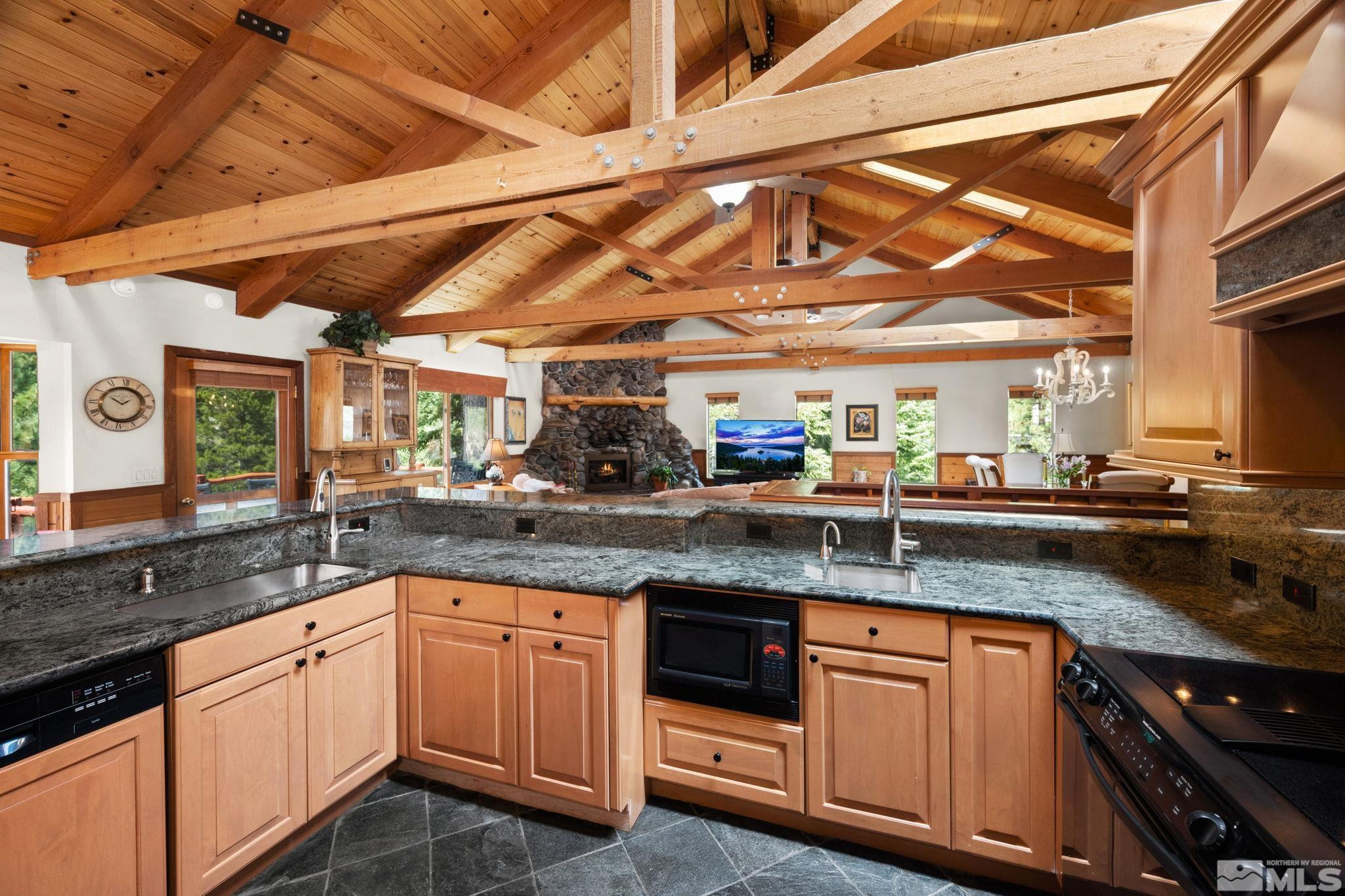 310 Barton Drive Stateline, NV 89449 - Photo 11 of 36 a kitchen with granite countertop a sink and cabinets