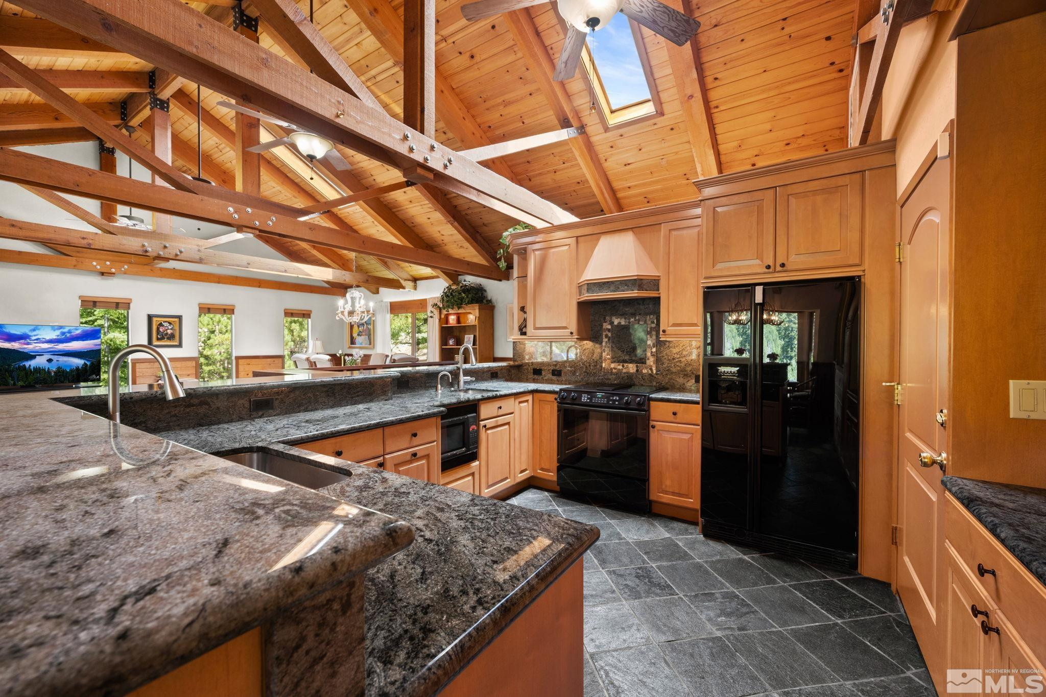 310 Barton Drive Stateline, NV 89449 - Photo 12 of 36 a kitchen with lots of counter top space and stainless steel appliances