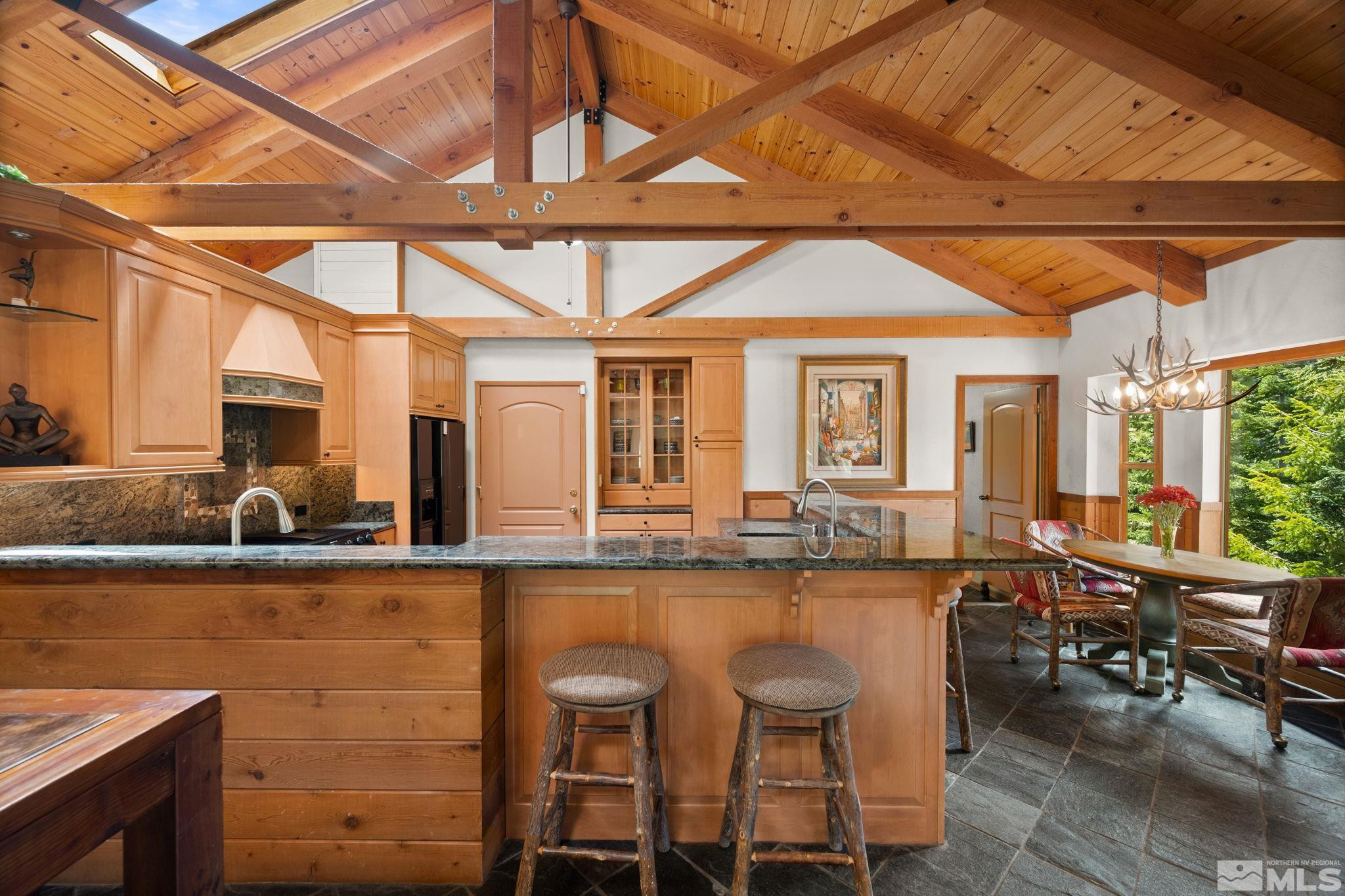 310 Barton Drive Stateline, NV 89449 - Photo 13 of 36 a dining hall with stainless steel appliances granite countertop a sink and cabinets