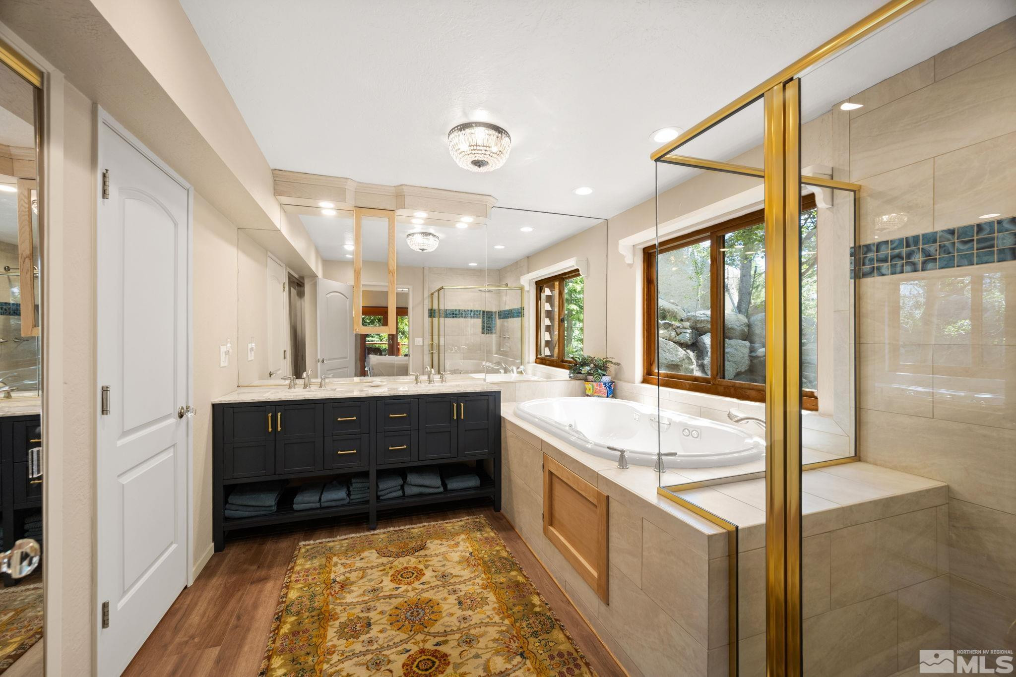 310 Barton Drive Stateline, NV 89449 - Photo 20 of 36 a bathroom with a bathtub sink and mirror