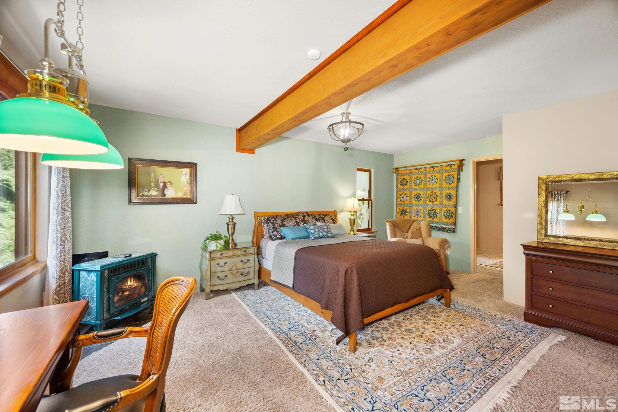 310 Barton Drive Stateline, NV 89449 - Photo 23 of 36 a bedroom with a bed and a dresser