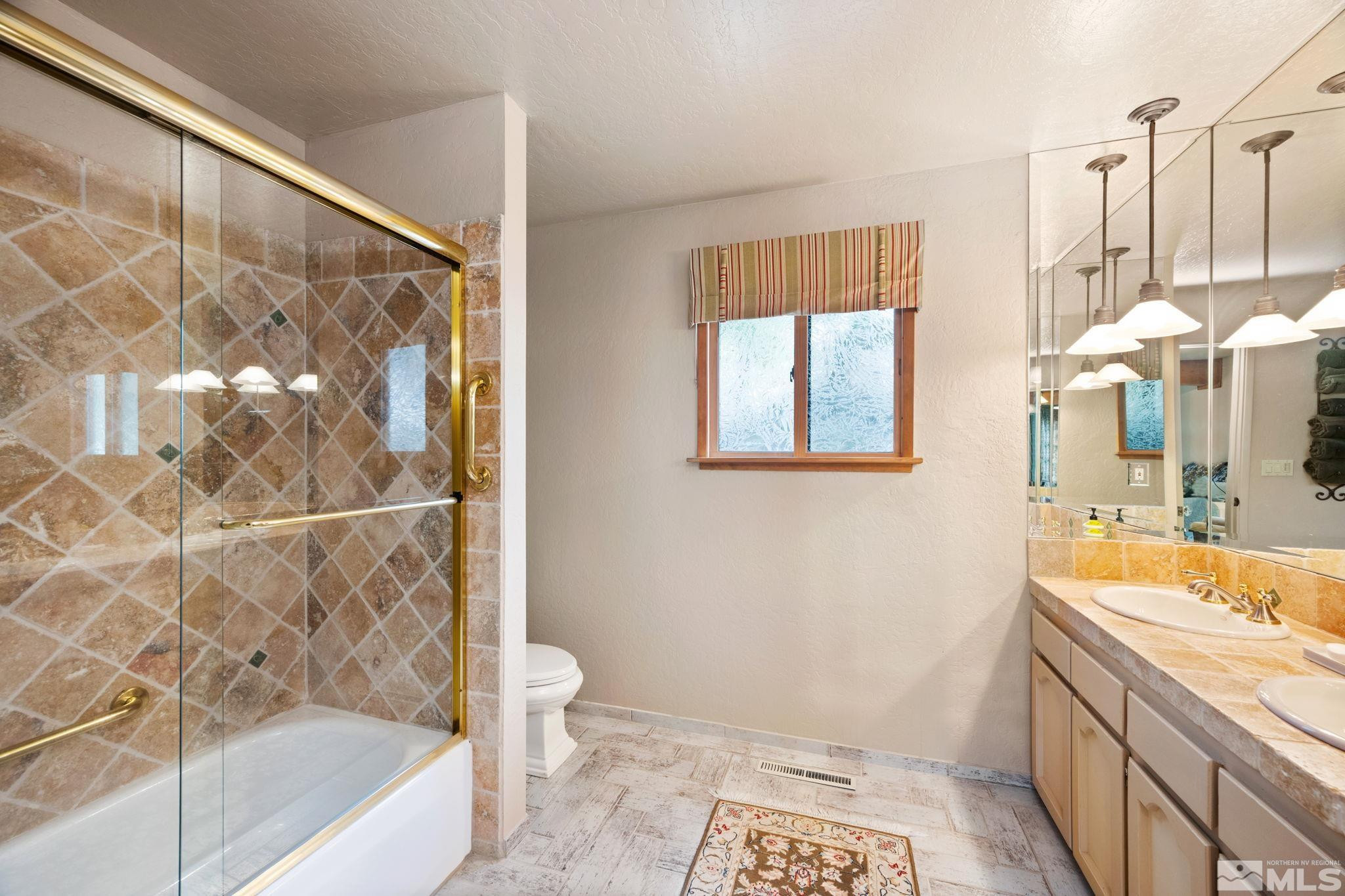 310 Barton Drive Stateline, NV 89449 - Photo 24 of 36 a bathroom with a sink and a bathtub
