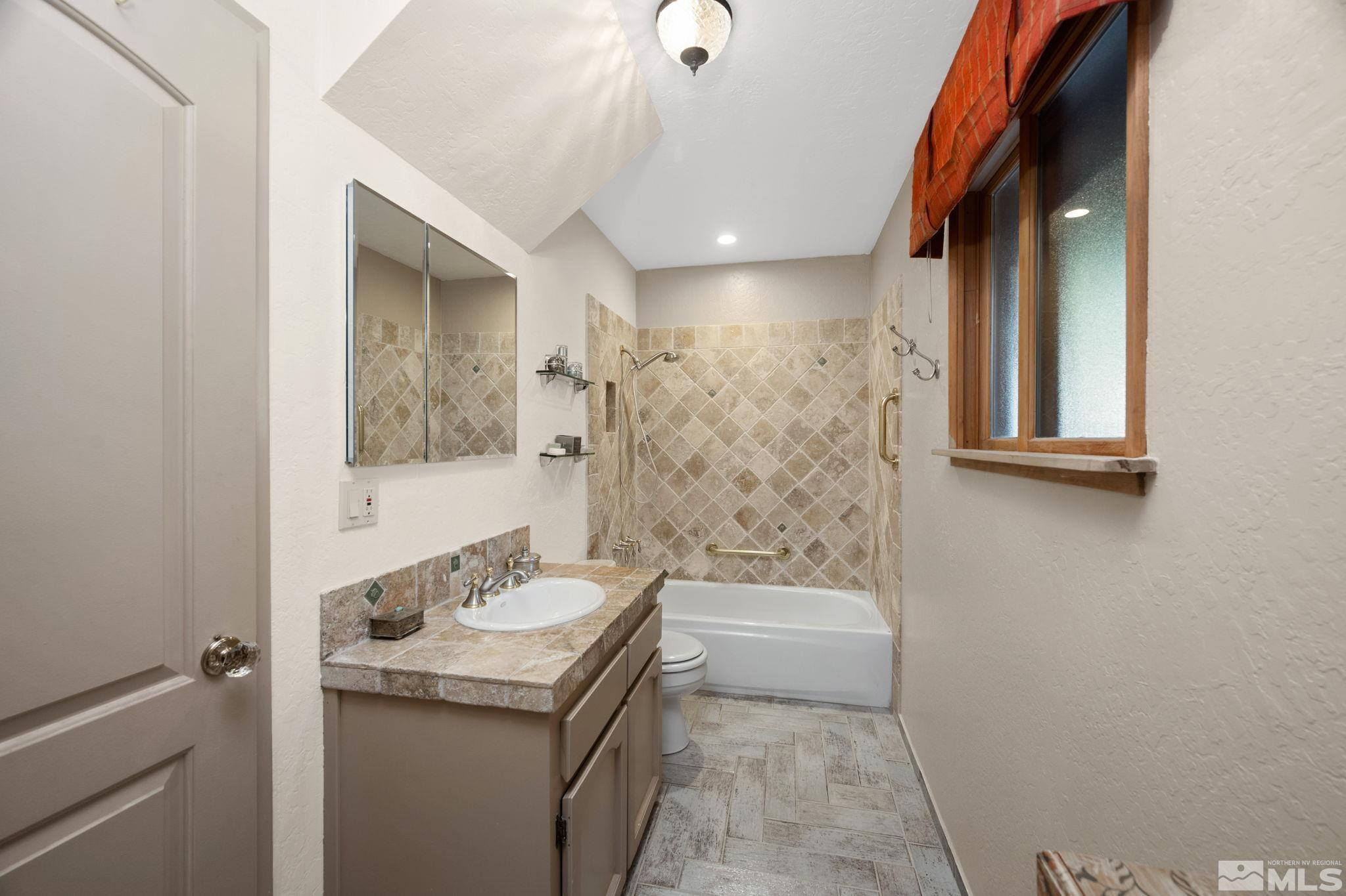310 Barton Drive Stateline, NV 89449 - Photo 26 of 36 a bathroom with a sink a toilet and shower