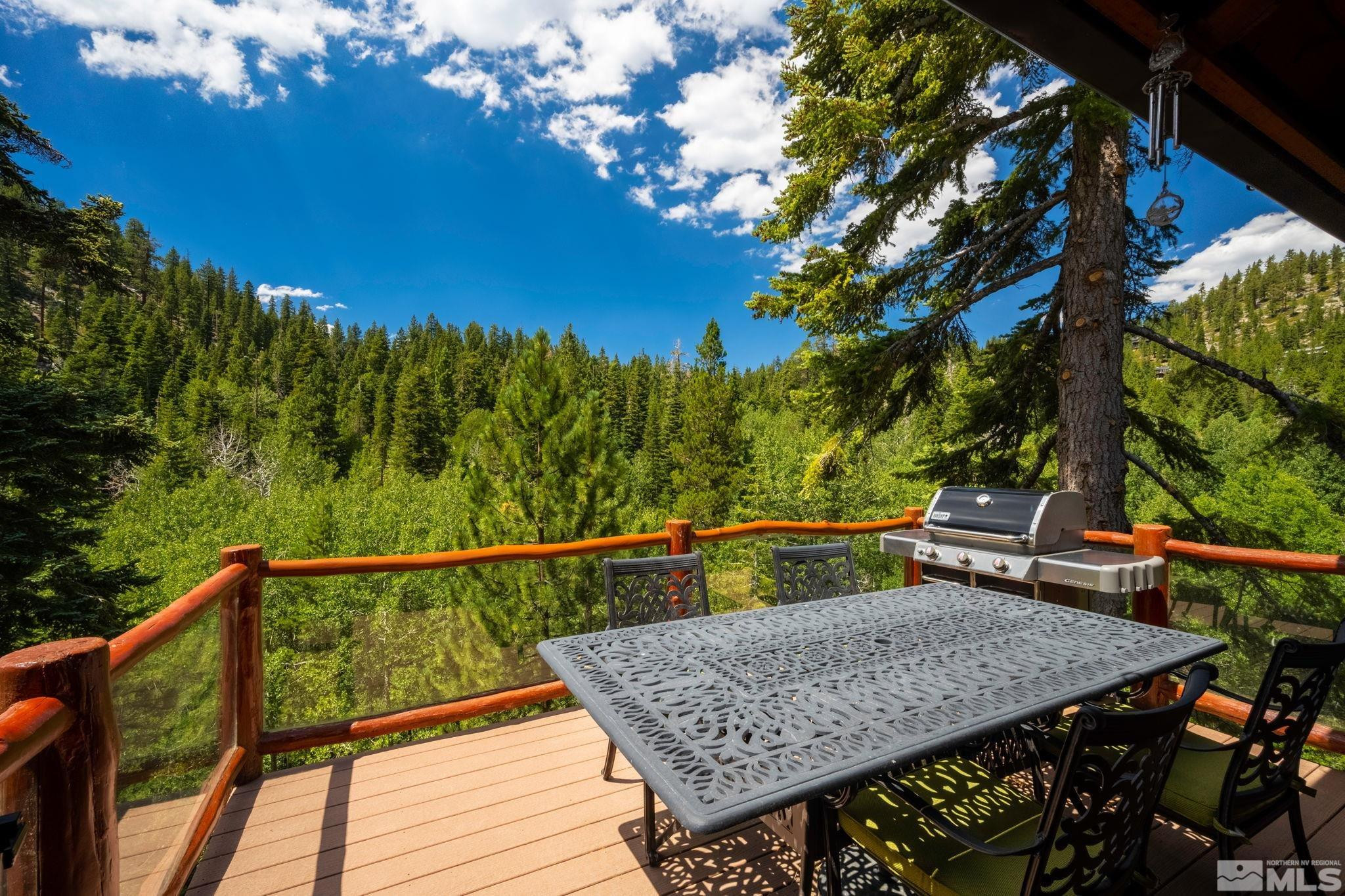 310 Barton Drive Stateline, NV 89449 - Photo 28 of 36 a view of a roof deck with wooden floor and fence