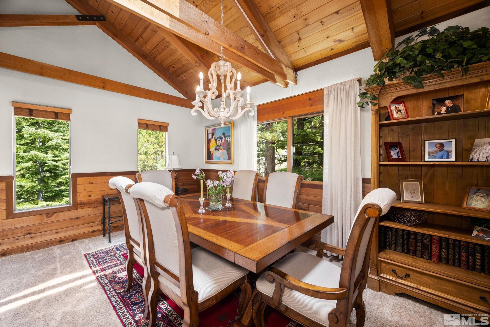 310 Barton Drive Stateline, NV 89449 - Photo 9 of 36 a dining room with furniture a rug and a large window