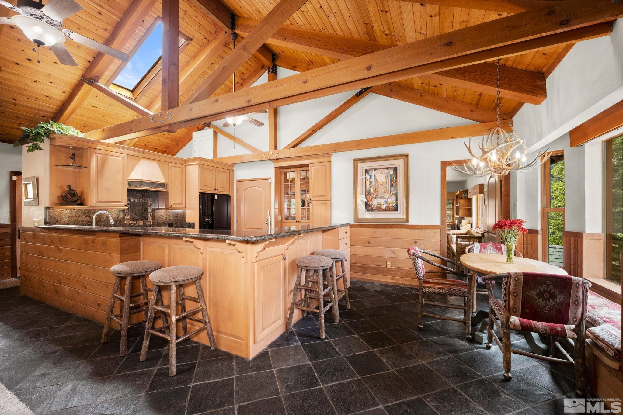 310 Barton Drive Stateline, NV 89449 - Photo 10 of 36 a dining area with glass top table and chairs