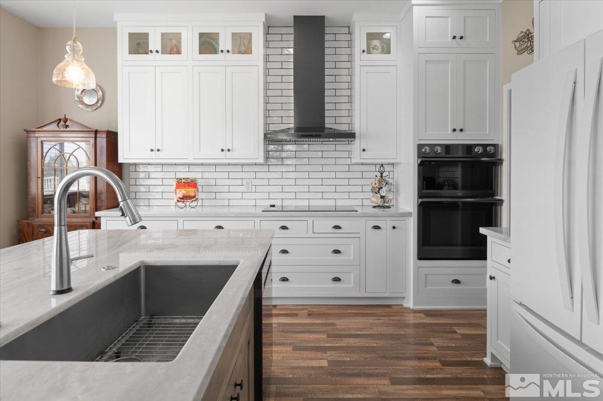 10754 Misty Meadows Drive Reno, NV 89521 - Photo 11 of 29 a kitchen with white cabinets and sink