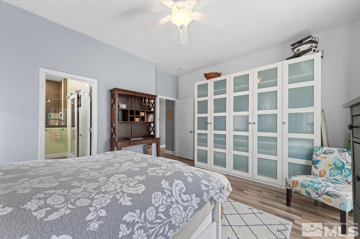 10754 Misty Meadows Drive Reno, NV 89521 - Photo 14 of 29 a bedroom with a bed and a large window