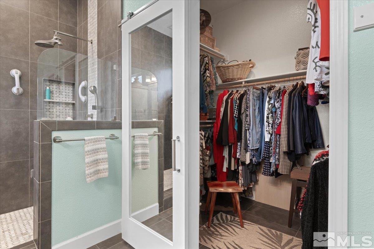 10754 Misty Meadows Drive Reno, NV 89521 - Photo 18 of 29 a view of walk in closet with clothes and shoes