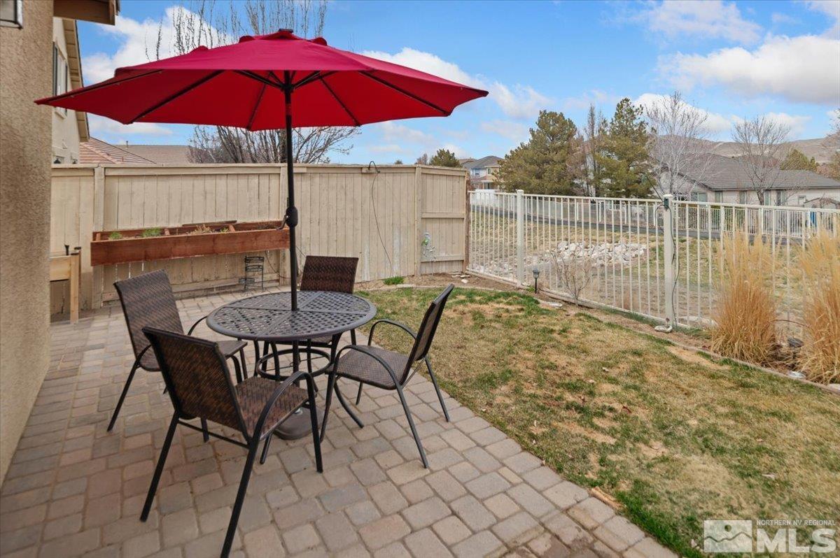 10754 Misty Meadows Drive Reno, NV 89521 - Photo 27 of 29 a view of balcony with wooden floor and outdoor seating