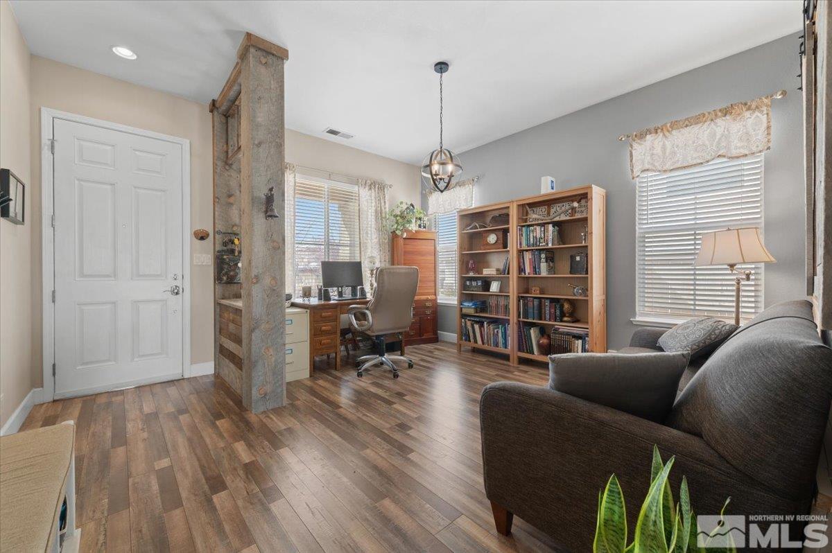 10754 Misty Meadows Drive Reno, NV 89521 - Photo 3 of 29 a living room with furniture a dining table and a window
