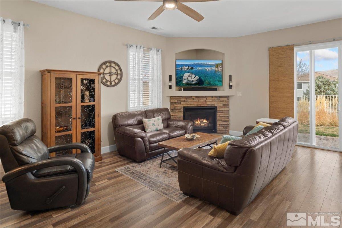 10754 Misty Meadows Drive Reno, NV 89521 - Photo 6 of 29 a living room with furniture and a fireplace