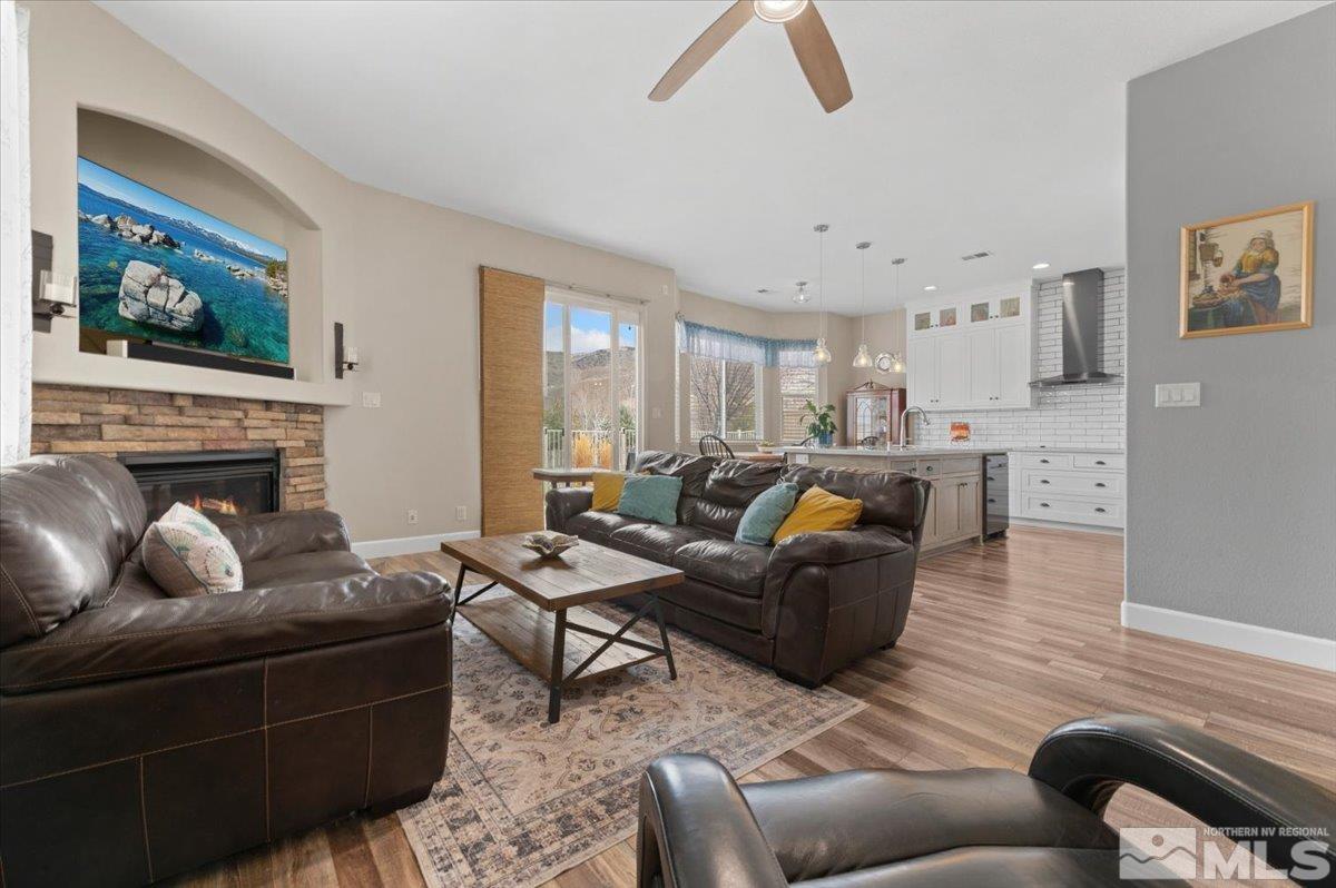 10754 Misty Meadows Drive Reno, NV 89521 - Photo 7 of 29 a living room with furniture or couch and a fireplace