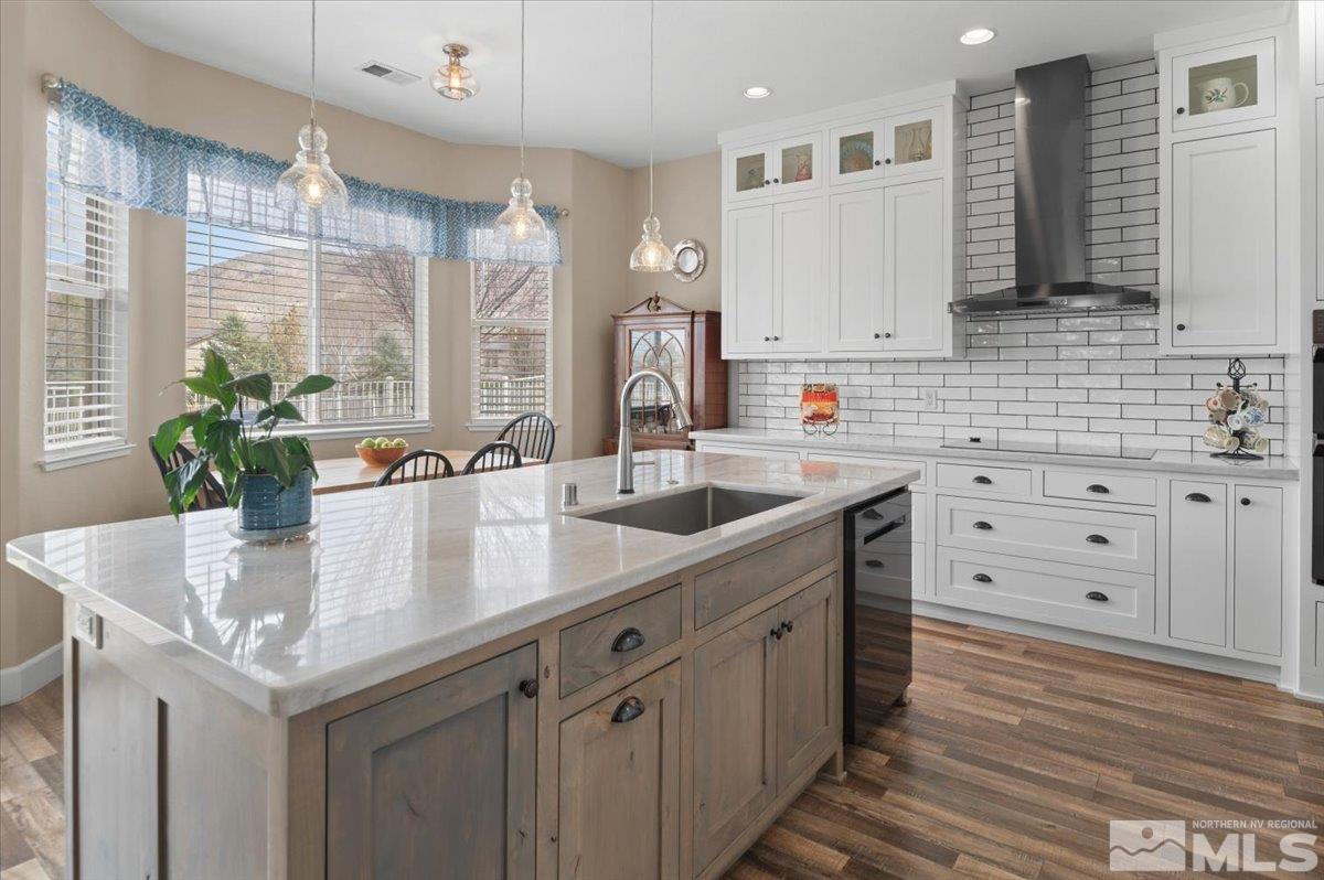 10754 Misty Meadows Drive Reno, NV 89521 - Photo 10 of 29 a kitchen with granite countertop a sink a counter space and cabinets