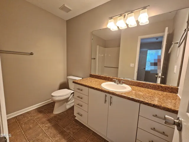 a bathroom with a sink and toilet