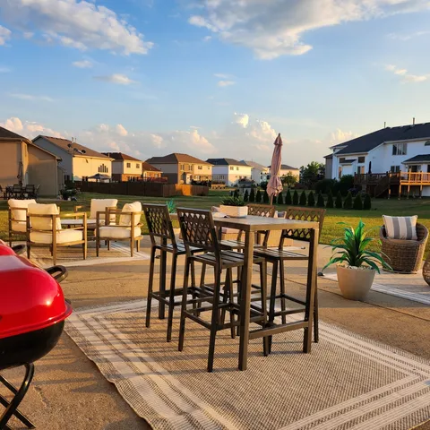 a view of a chairs and table on the terrace