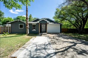 7301 Quicksilver Circle Austin, TX 78744 - Photo 1 of 15 a front view of a house with a garden