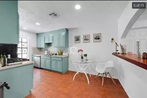 a kitchen with granite countertop sink cabinets and stainless steel appliances
