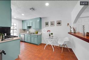 7301 Quicksilver Circle Austin, TX 78744 - Photo 5 of 15 a kitchen with granite countertop sink cabinets and stainless steel appliances