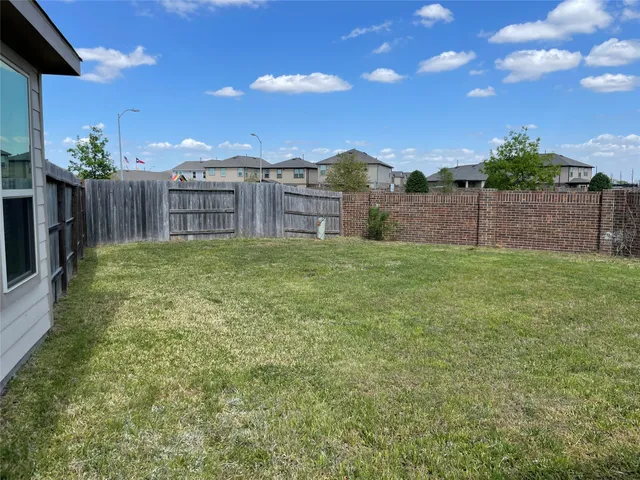 a view of a backyard of the house