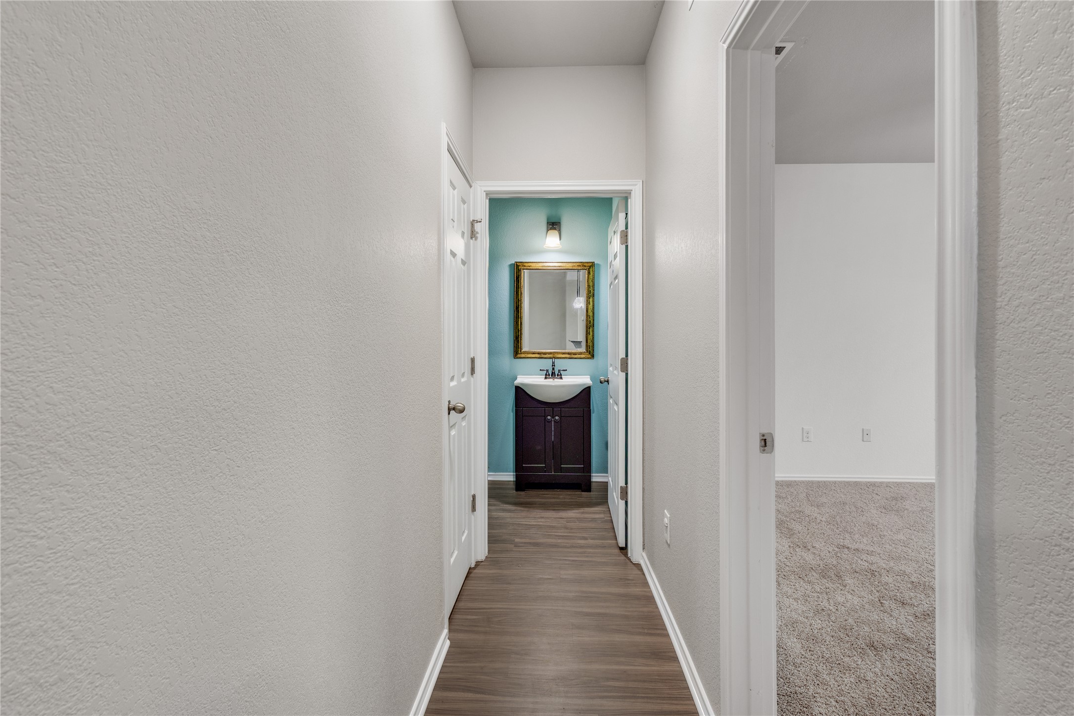 397 Limerick Road Buda, TX 78610 - Photo 12 of 33 A half bath is conveniently located off the main living space.