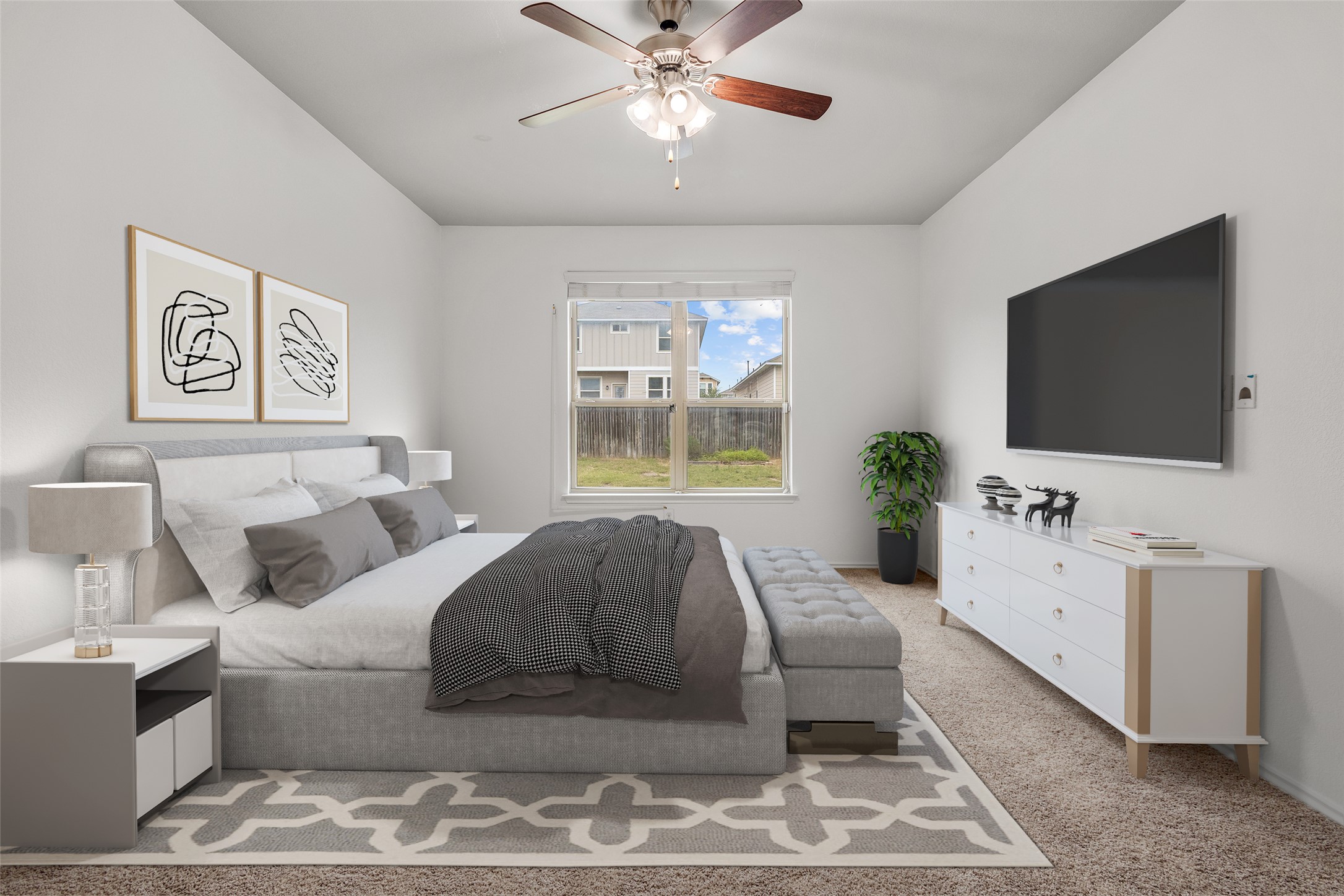 397 Limerick Road Buda, TX 78610 - Photo 14 of 33 The primary bedroom is tucked away off the main living space and has enough room for a king-sized bed, a full seating bench and a large media setup, it’s a versatile retreat. Virtually staged photo