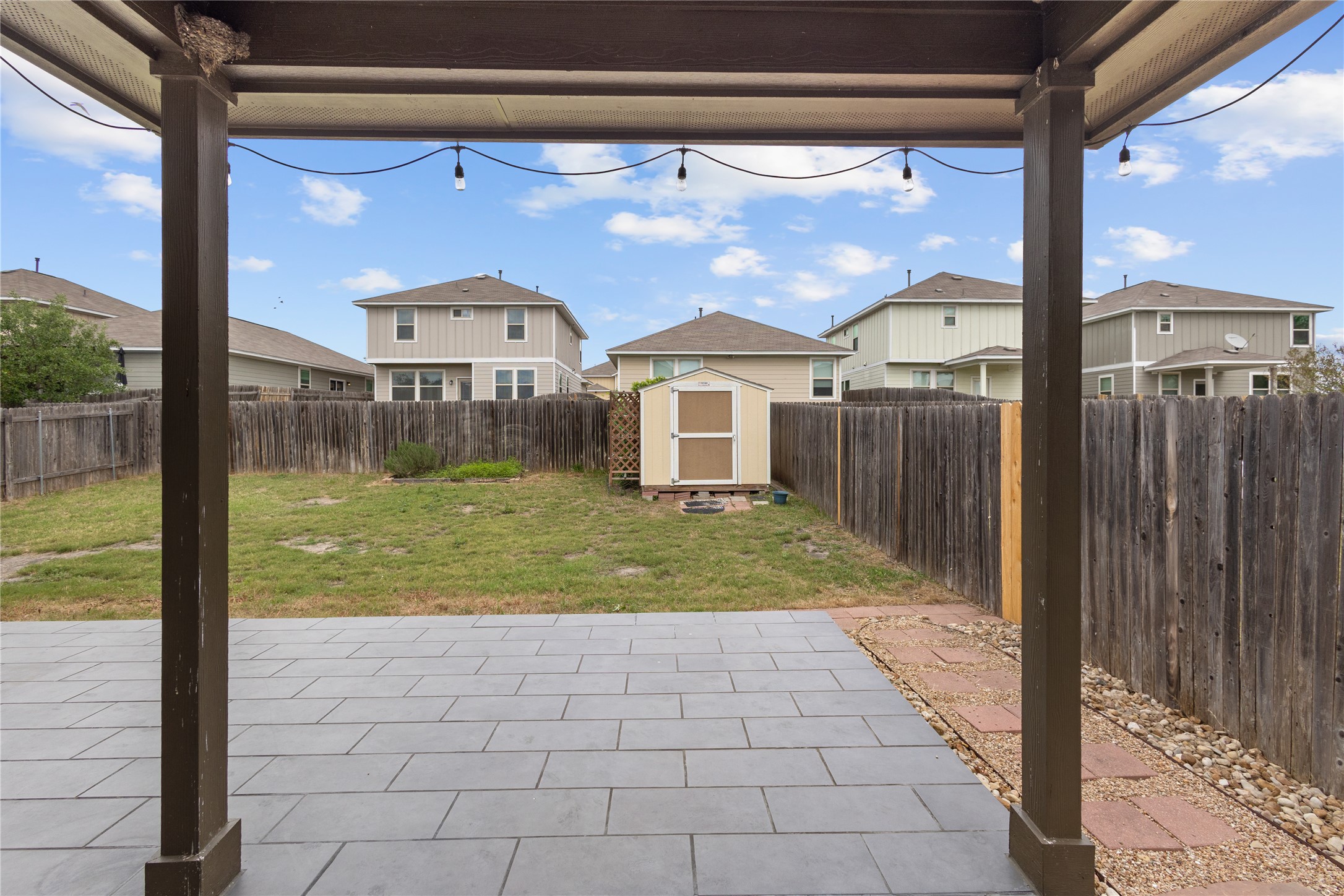 397 Limerick Road Buda, TX 78610 - Photo 28 of 33 The massive, oversized back patio is ready for its a summer BBQ.