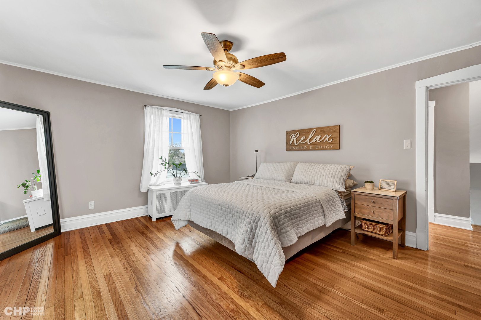 304 Maplewood Road Riverside, IL 60546 - Photo 18 of 38 a spacious bedroom with a bed and a window