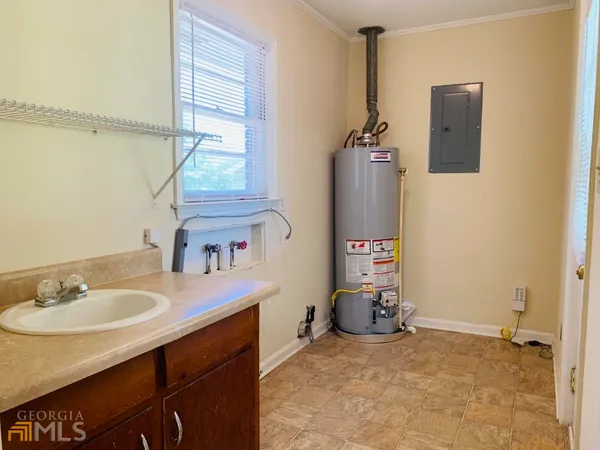 a bathroom with a sink vanity and a mirror