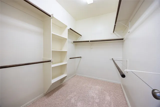 a view of a hallway with paintings on the wall