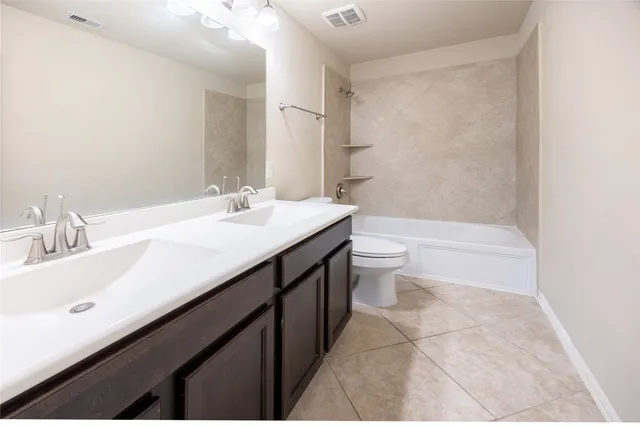 a front view of a house with a yard and porch