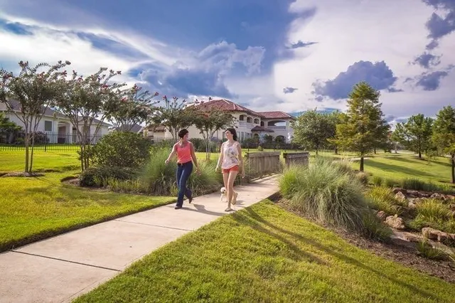 a view of swimming pool with seating area