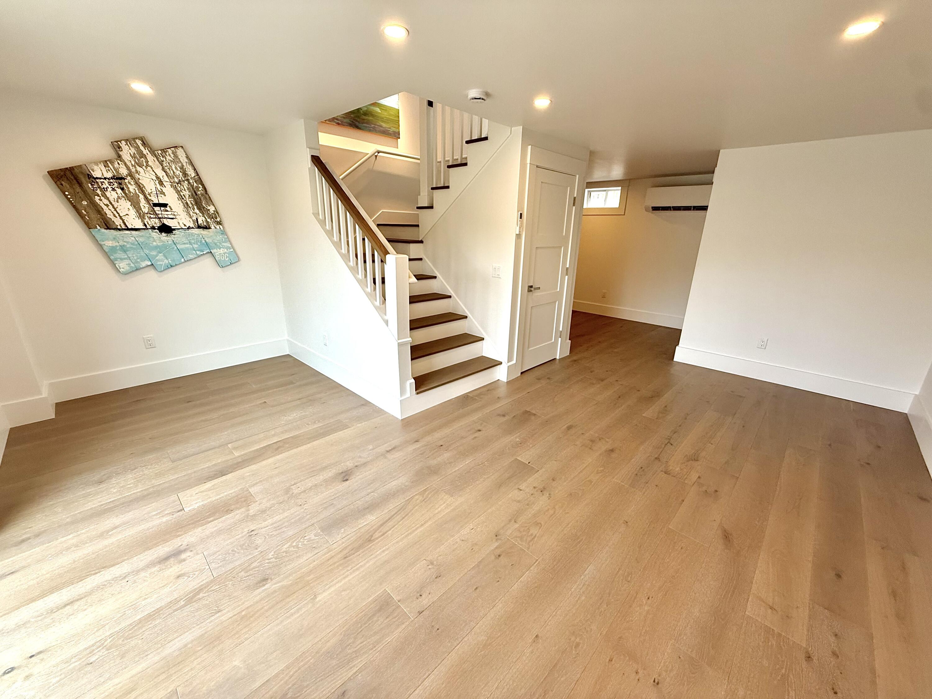 29 Cemetery Road, Unit 2 Provincetown, MA 02657 - Photo 9 of 30 a view of entryway with wooden floor and stairs