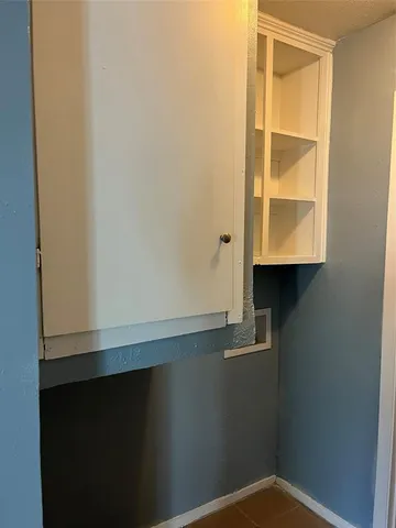 a white toilet sitting next to a bath tub