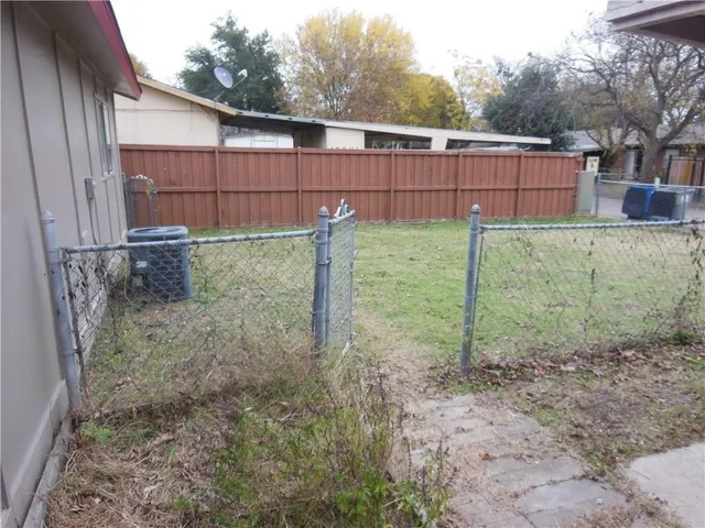 a front view of house with yard and trees