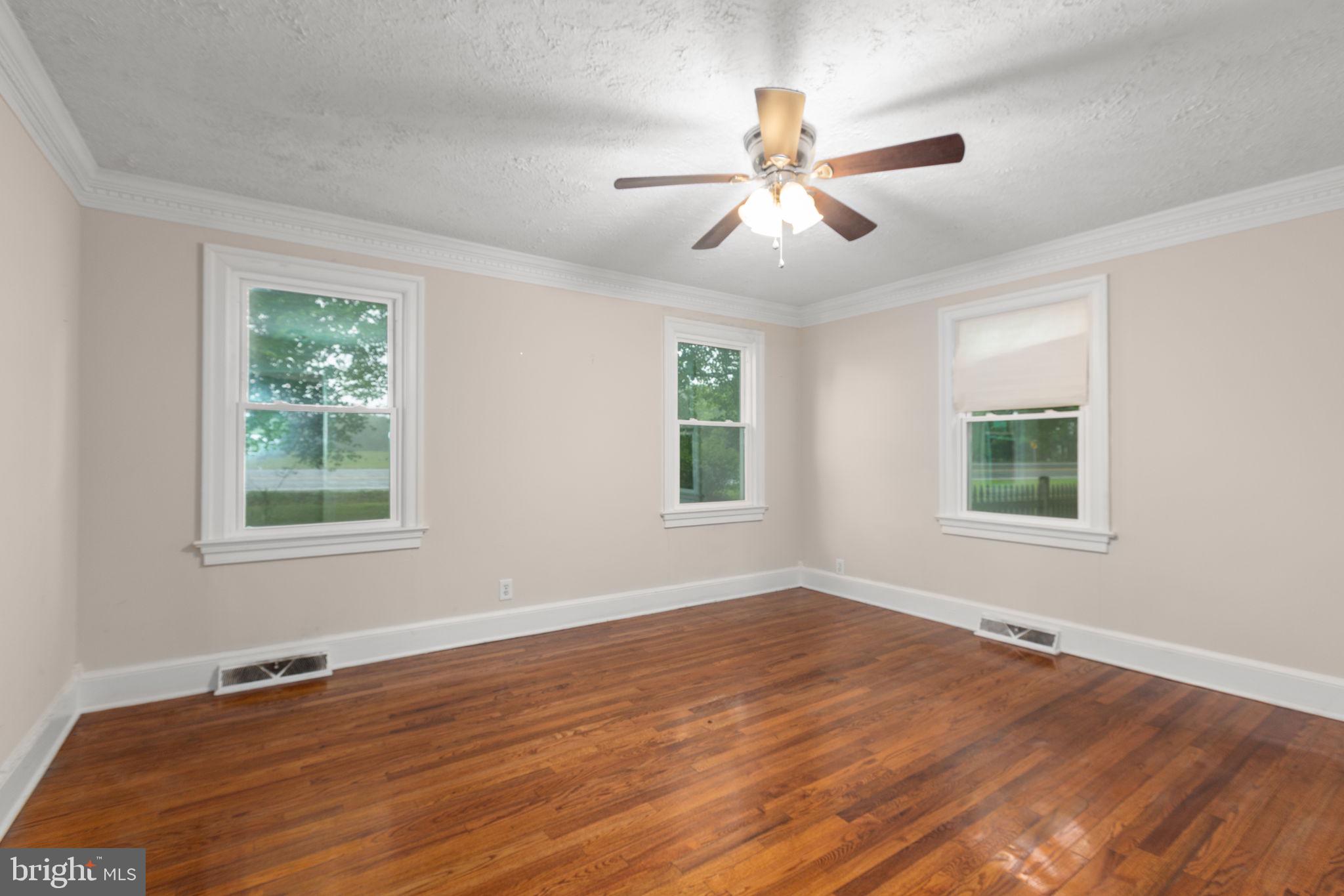 10669 Post Oak Road Spotsylvania, VA 22551 - Photo 17 of 27 Bedroom #2 has crown molding and hardwood flooring