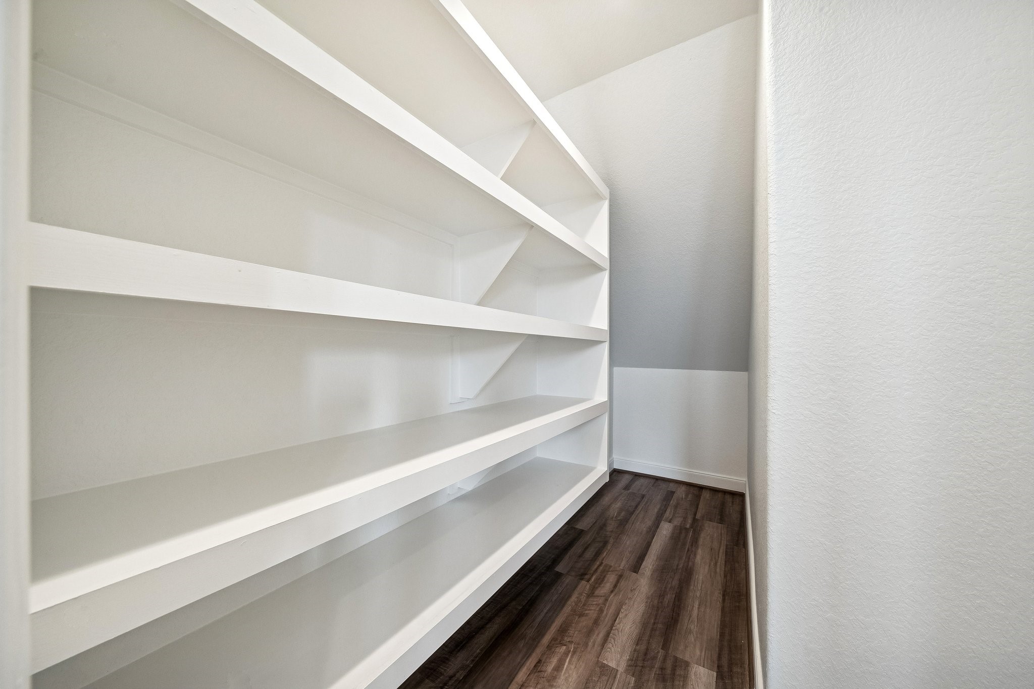 9817 Prairie Garden Lane Houston, TX 77080 - Photo 11 of 36 a storage room with wooden floor