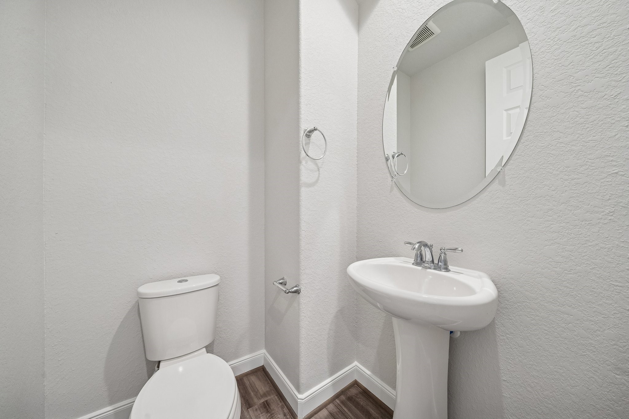 9817 Prairie Garden Lane Houston, TX 77080 - Photo 13 of 36 a bathroom with a toilet sink and mirror