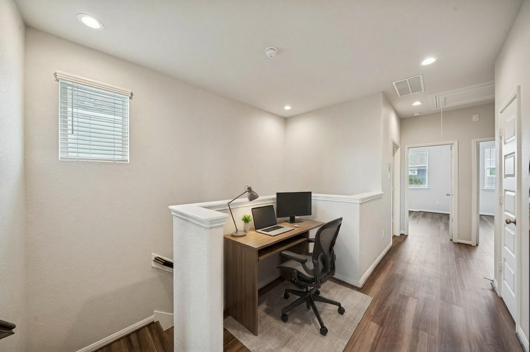 9817 Prairie Garden Lane Houston, TX 77080 - Photo 14 of 36 a view of a workspace with furniture and wooden floor